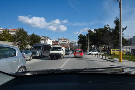 view from car of city street on sunny dayの写真素材