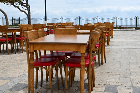 empty wooden tables and chairs outdoorsの写真素材
