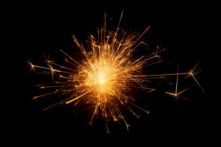 close up of burning sparkler against black backgroundの写真素材