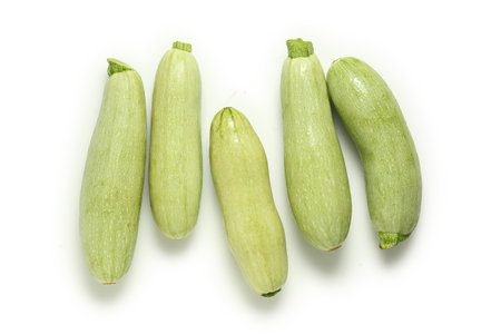 top view of raw zuchhinis on whiteの写真素材