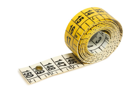 rolled tailor's tape measure isolated on white
