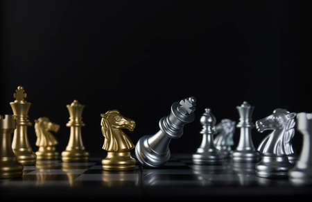 Chess (knight or horse wins the game) on black background. Success, business strategy, tactics, win,...