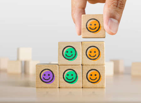 Positive attitude, customer satisfaction, emotional management or happiness concept. Wooden blocks...
