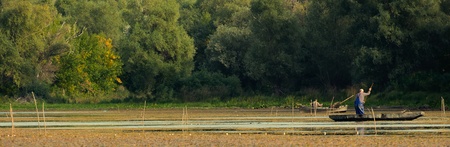 Two Anglers Fishing on A Lakeの写真素材