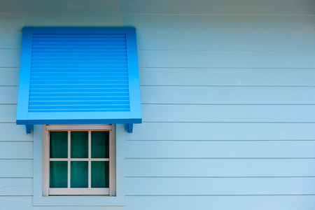 Isolated old window frame and wall on a old house の写真素材