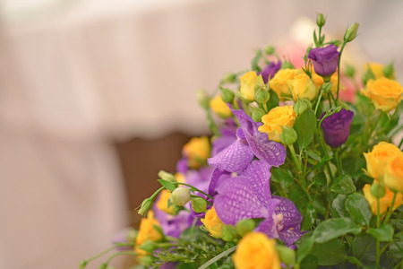 Yellow and purple flower decoration of wedding table の写真素材