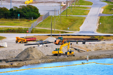 Bulldozer and excavator on road construction の写真素材
