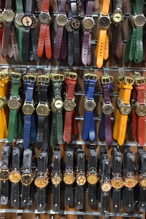 Group of unisex watches on the wallの写真素材