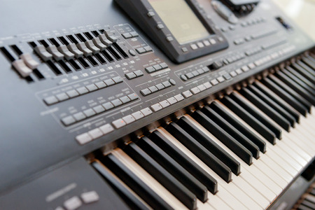 Electronic organ with many buttons and digital displayの写真素材