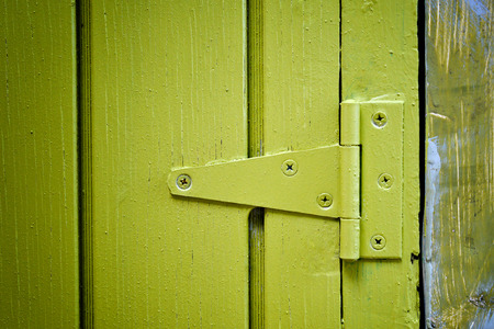 Yellow door hingeの写真素材