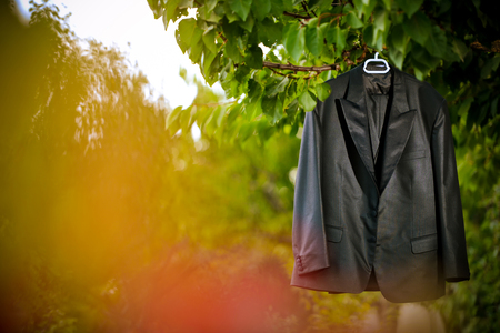 Groom suit hanging by the treeの写真素材