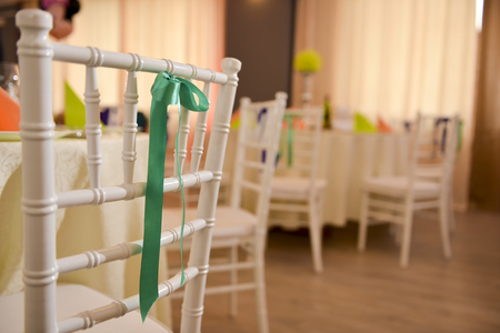 White wooden chair with a green bowの写真素材