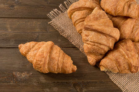 Breakfast croissant on a rustic backgroundの写真素材