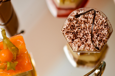 Colorful Cake sitting on a mirrorの写真素材