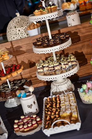 Candy bar on a stand during the wedding reception