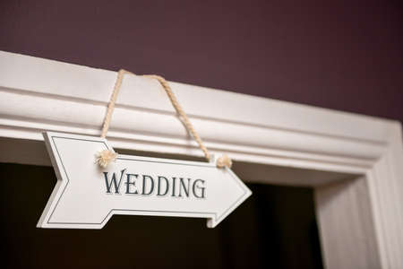 Wedding sign hanged on top of doorの写真素材