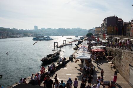 Porto, Portugal - September 16, 2018 : On the banks of the Douro River of the beautiful city of...