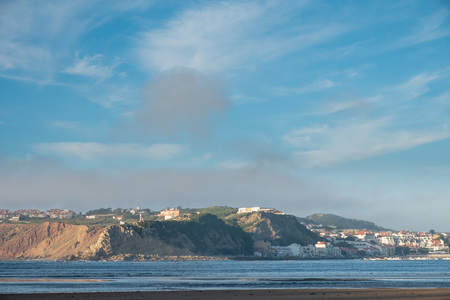 S. Martinho do Porto, Portugal - September 20, 2018 : Nearly closed sea bay, fine sand beach and...