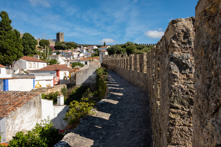 Obidos, Portugal - September 21, 2018 : Within the walls of the historic village in the center of portugal the narrow streets and colorful houses Leiria, Portugalのeditorial素材
