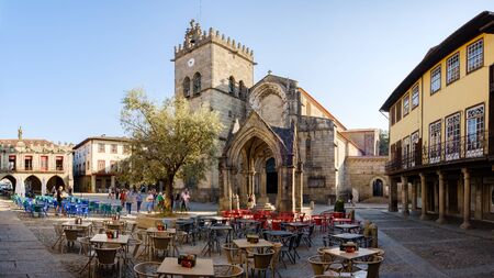 Guimaraes, Portugal - September 26, 2018 : The Largo do Oliveira as the beautiful Monument Padrao do...