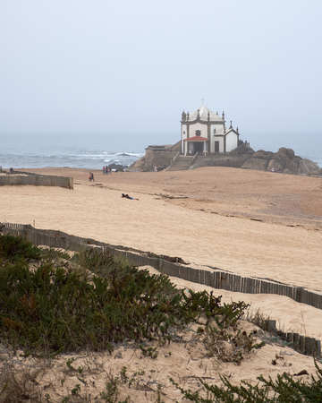 Vila Nova de Gaia, Portugal - September 30, 2018 : Foggy day by the sea next to the chapel Porto district, Portugalのeditorial素材