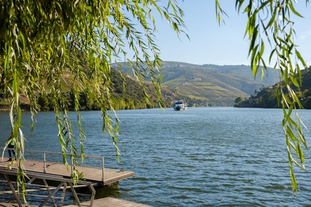 Pinhao, Portugal - October 05, 2018 : Boat carrying tourists on the Douro River, Vila Real, Portugalのeditorial素材