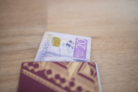 20 Swedish Kronor Banknote Partially Inside a Sweden Passportの写真素材