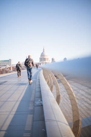 Photo of St Pauls Cathedral from Millenium Bridge with People Walkingのeditorial素材
