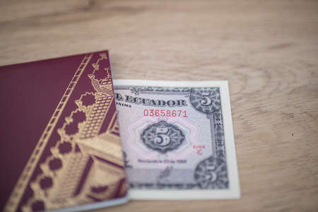 Five Ecuadorian Sucres Bill Partially Inside a Sweden Passportの写真素材