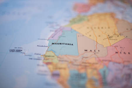 Mauritania on a colorful and blurry map of Africa with its main routes in redの写真素材