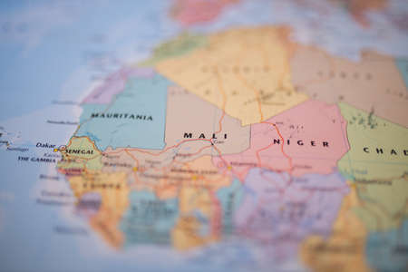 Mali on a colorful and blurry map of Western Africa with its main routes in redの写真素材