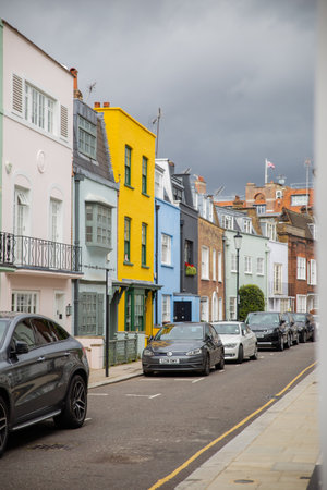 Row of colorful British houses with cars parked outsideのeditorial素材