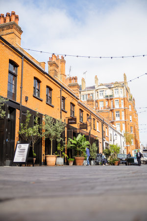 Row of brick buildings with restaurants in Pavilion Roadのeditorial素材