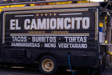 Black vegetarian food truck parked on the streetのeditorial素材