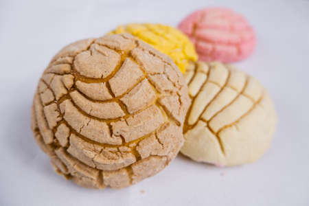 Colorful Mexican sweet bread on a white table