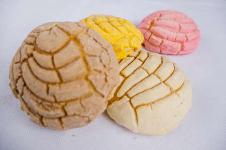 Colorful Mexican sweet bread on a white table