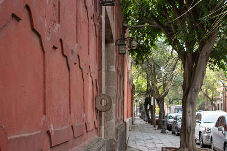 Red wall from an old building in Mexico Cityの写真素材