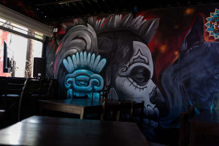 Beautiful mural in restaurant of woman with Mexican skeleton faceの写真素材
