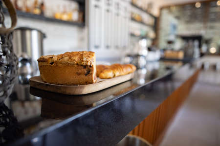 Tasty pie and bread on cafe counter with blurry backgroundの写真素材