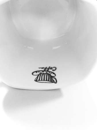 coffee cup fallen on floor over white background