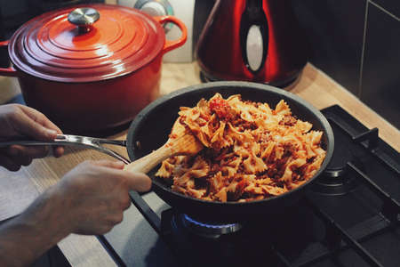Pasta being prepared in a pan