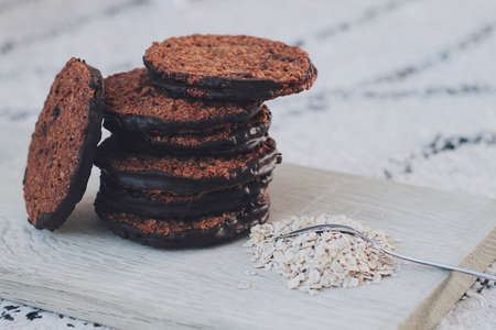 Homemade chocolate oatmeal cookies on a cutting boardの写真素材