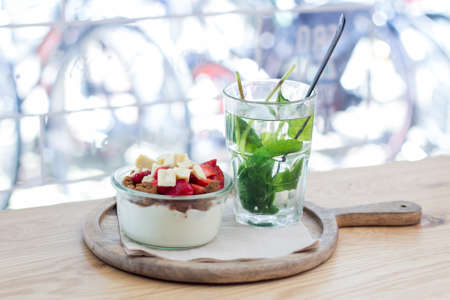 Yogurt breakfast with fresh mint teaの写真素材