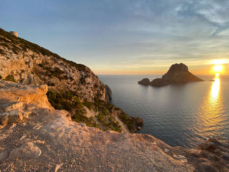 Sunset on the coast of Ibiza island with Es Vedraの写真素材