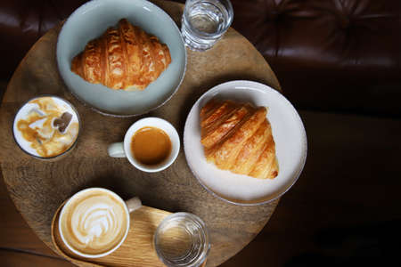 Coffee and croissants in a coffee barの写真素材