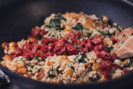 Warm orzo meal in a pan with pumpkinの写真素材