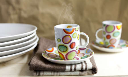 A cup of coffee on a wooden tableの写真素材