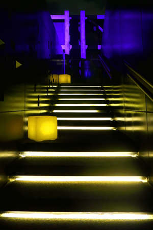 Yellow neon lit staircaseの写真素材