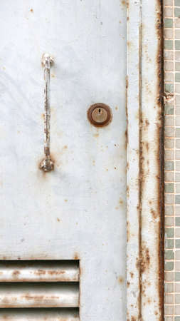 Outdoor metal Door with lock in the buildingの写真素材