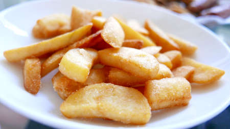 Homemade potato fries on the white dishの写真素材